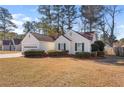 Attractive single-story home with manicured shrubs and an attached garage at 4519 Legend Hollow Ln, Powder Springs, GA 30127