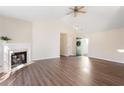 Spacious living room with a fireplace, vaulted ceiling, and hardwood floors at 4519 Legend Hollow Ln, Powder Springs, GA 30127