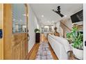 Inviting living room with hardwood floors, open layout, modern furnishings, and seamless flow to the kitchen at 57 Moury Se Ave, Atlanta, GA 30315