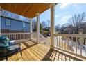 Relaxing porch with wood flooring, decorative railing, and comfortable seating at 57 Moury Se Ave, Atlanta, GA 30315