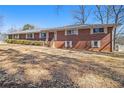 Classic brick home with a well-manicured front yard, showcasing its timeless appeal at 346 Mays Rd, Stockbridge, GA 30281