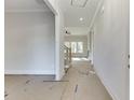 Bright entryway showcasing stairs, natural light, and freshly painted walls at 4356 Hamilton Mill Rd, Buford, GA 30518