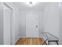 A bright hallway with hardwood floors and a neutral color scheme offers a welcoming entrance at 215 Piedmont Ave # Apt 402, Atlanta, GA 30308