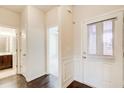 Bright entryway featuring hardwood floors, white trim, and a view to other rooms at 563 Carleton Pl, Locust Grove, GA 30248