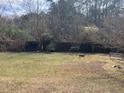 Spacious backyard with a wooden fence, offering privacy and room for outdoor activities at 355 Tait Rd, Stockbridge, GA 30281
