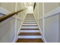 View of the beautiful home stairway with white wood trim and a handrail leading upstairs at 1013 Canyon Point Cir, Roswell, GA 30076