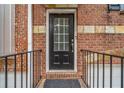 Welcoming front door with glass accents and a sturdy railing for easy access at 5341 Concordia Se Pl # 8, Mableton, GA 30126