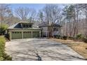 Lovely home featuring a three-car garage and a well-maintained lawn, creating a welcoming curb appeal at 218 Sutallee Ridge Ne Ct, White, GA 30184