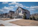 Beautifully landscaped home with a two-car garage, covered porch, and a well-manicured lawn in a residential neighborhood at 2300 Kate Moore Way, Buford, GA 30518