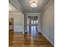 A wide hallway with wood floors leads to other rooms, highlighting the home's open layout at 2300 Kate Moore Way, Buford, GA 30518