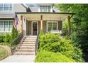 Inviting front porch featuring a porch swing, wooden columns, and a well-manicured lawn at 2922 Parkridge Ne Dr, Brookhaven, GA 30319