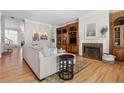 Elegant living room features hardwood floors, a fireplace, custom built-ins, and ample natural light at 1029 Emory Parc Pl, Decatur, GA 30033