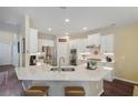 Modern kitchen with white cabinets, stainless steel appliances, quartz countertop, and a center island at 1907 Haven Park Se Cir, Smyrna, GA 30080