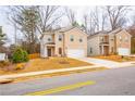 Street view of the exterior of two homes featuring brick facades and a well-manicured front lawn at 4700 Blake Loop, Atlanta, GA 30349