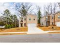 Street view of the exterior of two homes featuring brick facades and a well-manicured front lawn at 4700 Blake Loop, Atlanta, GA 30349