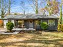 Charming single-story home with a cozy front porch and well-maintained landscaping at 1377 Dorothy Se Dr, Decatur, GA 30030