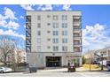 Apartment building with multiple floors featuring balconies and street parking in front at 525 Parkway Dr Ne # 203, Atlanta, GA 30354