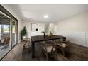 Dining room featuring modern table, decor, hardwood floors, and slider doors at 3385 Lyndale St, Douglasville, GA 30135