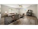 Bright living room with large windows, neutral paint, modern furniture, and stylish rug at 3385 Lyndale St, Douglasville, GA 30135