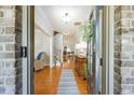 Welcoming foyer featuring hardwood floors, staircase, and elegant decor at 8220 Majors Ridge Way, Cumming, GA 30041