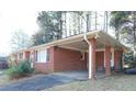 Brick carport showcasing the side exterior features at 1879 Mural Cir, Morrow, GA 30260