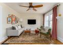 Bright and airy living room featuring hardwood floors, ceiling fan, and modern decor at 306 Nelms Ne Ave, Atlanta, GA 30307