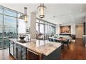 Open-concept kitchen featuring granite countertops and stainless steel appliances at 1065 Peachtree Ne St # 3005, Atlanta, GA 30309