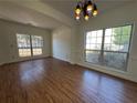 Bright dining room featuring hardwood floors and large windows at 2979 Belfaire Crest Ct, Dacula, GA 30019