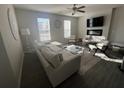 Bright living room with hardwood floors, modern furniture, and abundant natural light at 1852 Laurel Green Way, East Point, GA 30344