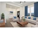 Bright living room with hardwood floors, white walls, and stylish furniture at 501 Harris Ave, Palmetto, GA 30268