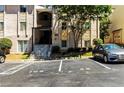 Exterior view of building with stairs leading to entrance, manicured shrubbery and allocated parking at 2396 Lawrenceville Hwy # V, Decatur, GA 30033