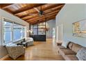 Spacious living room with hardwood floors, large windows, vaulted ceilings, and stylish furnishings at 6275 Hunting Creek Rd, Atlanta, GA 30328