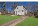 Backyard view featuring a long driveway and beautiful lawn at 1630 Sylvan Sw Rd, Atlanta, GA 30310