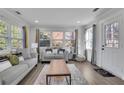 Bright living room with hardwood floors, neutral paint, and large windows at 1630 Sylvan Sw Rd, Atlanta, GA 30310