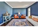 Cozy living room featuring hardwood floors, and blue painted walls at 571 Tahoe Cir, Stone Mountain, GA 30083