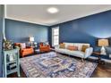 Cozy living room featuring hardwood floors, and blue painted walls at 571 Tahoe Cir, Stone Mountain, GA 30083