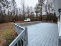 Large, wooden back deck with gray finish at 5559 John Burruss Rd, Cumming, GA 30040