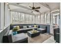 Relaxing screened porch with comfortable seating and a ceiling fan at 1830 Greystone Ct, Marietta, GA 30068