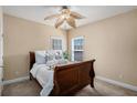 Cozy bedroom with neutral tones, soft carpet, and a ceiling fan for added comfort at 1760 Carissa Dr, Conyers, GA 30094