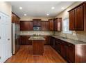 Well-equipped kitchen featuring granite countertops, custom cabinets, and stainless steel appliances at 1760 Carissa Dr, Conyers, GA 30094