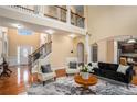 Elegant living room with hardwood floors, high ceilings, and abundant natural light at 1760 Carissa Dr, Conyers, GA 30094