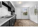 Bright kitchen features modern appliances, stylish cabinets, and hardwood floors at 3063 Kerr Dr, Decatur, GA 30034