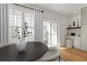 Charming dining area with natural light, features a view of the outdoor balcony at 201 New St # 2305-1, Decatur, GA 30030