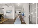 Elegant entryway with hardwood floors and stylish decor leading into the living spaces at 3730 Near Star Ln, Cumming, GA 30028