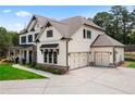 Beautiful two-story home with a two-car garage and well-maintained landscaping at 805 Dempsey Ct, Marietta, GA 30064