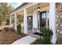 Inviting front porch features classic columns, brick accents, and a stylish entryway at 805 Dempsey Ct, Marietta, GA 30064