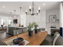 An open-concept kitchen and dining area, showcasing modern design and a large island with seating at 201 New St # 1102-8, Decatur, GA 30030