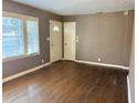 Cozy living room featuring gleaming hardwood floors and large windows for natural light at 2736 Claire Ter, Decatur, GA 30032