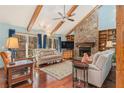 Inviting living room featuring hardwood floors, a stone fireplace, and vaulted ceilings at 487 Glendale Ct, Stone Mountain, GA 30087