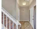 Bright foyer with hardwood floors, staircase, and elegant lighting at 2701 Garland Way Way, Duluth, GA 30096